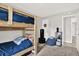 Cozy bedroom featuring a wooden bunk bed, perfect for or guests at 3615 Greatwood Ct, Land O Lakes, FL 34639