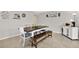 Bright dining area featuring a wood table with bench, and stylish decor at 3615 Greatwood Ct, Land O Lakes, FL 34639