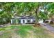 Charming single-story home with a well-manicured lawn and beautiful landscaping, creating inviting curb appeal at 3615 Greatwood Ct, Land O Lakes, FL 34639
