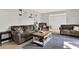 Comfortable living room with neutral walls, tile floors, and a large area rug that provides a cozy feel at 3615 Greatwood Ct, Land O Lakes, FL 34639