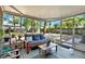 Relaxing porch area with comfortable seating and views of the lush backyard, ideal for enjoying the outdoors at 3615 Greatwood Ct, Land O Lakes, FL 34639