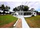Expansive backyard with lush lawn and patio area perfect for outdoor enjoyment and relaxation at 38819 Otis Allen Rd, Zephyrhills, FL 33540