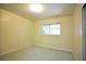 Cozy bedroom featuring neutral carpeting, a window and natural light at 38819 Otis Allen Rd, Zephyrhills, FL 33540