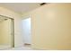Bedroom features neutral colored walls, mirrored closet, carpeted floor, and an abundance of light at 38819 Otis Allen Rd, Zephyrhills, FL 33540