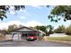 Charming single-story home with a porte-cochere and well-maintained front yard at 38819 Otis Allen Rd, Zephyrhills, FL 33540