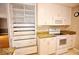 Kitchen features white cabinetry and stainless steel appliances at 38819 Otis Allen Rd, Zephyrhills, FL 33540