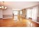 Spacious living room with hardwood floors and stone accent wall at 38819 Otis Allen Rd, Zephyrhills, FL 33540