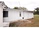Exterior of the shed with white siding, showcasing the potential for storage or workshop space at 38819 Otis Allen Rd, Zephyrhills, FL 33540