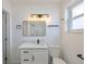 This bathroom features modern vanity, and matching fixtures with a classic design at 410 Virginia Ave, Madeira Beach, FL 33708