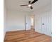 Bedroom features laminate flooring, neutral walls, recessed lighting, a fan, and two doors at 410 Virginia Ave, Madeira Beach, FL 33708