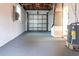 This large garage is painted with gray floors and has plenty of room for storage at 410 Virginia Ave, Madeira Beach, FL 33708