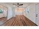 Spacious living room features beautiful laminate flooring, recessed lighting, and plenty of natural light at 410 Virginia Ave, Madeira Beach, FL 33708