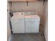 Dedicated laundry area featuring a washer and dryer set for convenient in-home laundry at 4111 Ashford Green Pl # B203, Tampa, FL 33613