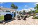 Back yard with patio including fire pit and water views with room for entertaining at 4492 Kingston Dr, Hernando Beach, FL 34607