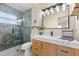 Modern bathroom featuring a stylish vanity, contemporary lighting, and a luxurious walk-in shower with textured tiling at 4492 Kingston Dr, Hernando Beach, FL 34607