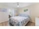 Inviting bedroom with a queen bed, calming decor, and natural light, complete with an ensuite bathroom at 4492 Kingston Dr, Hernando Beach, FL 34607