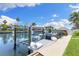 Boat dock with boat lift and water views at 4492 Kingston Dr, Hernando Beach, FL 34607