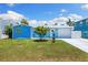 Charming turquoise home with a well-manicured lawn and lovely curb appeal, perfect for coastal living at 4492 Kingston Dr, Hernando Beach, FL 34607