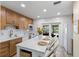 Modern kitchen with quartz countertops, stainless steel appliances, and an island with seating at 4492 Kingston Dr, Hernando Beach, FL 34607