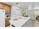 Modern kitchen with quartz countertops, stainless steel appliances, and an island with seating at 4492 Kingston Dr, Hernando Beach, FL 34607