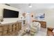 Inviting living room featuring stylish decor, comfortable seating, and a bright, open layout with kitchen views at 4492 Kingston Dr, Hernando Beach, FL 34607