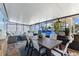 Spacious enclosed patio with multiple seating areas and an above ground pool, creating an outdoor oasis at 4492 Kingston Dr, Hernando Beach, FL 34607