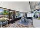 Enclosed patio with bar and dining area, providing a relaxing space for outdoor gatherings at 4492 Kingston Dr, Hernando Beach, FL 34607
