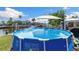 Back yard with water views and large above ground pool at 4492 Kingston Dr, Hernando Beach, FL 34607
