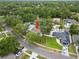 Aerial view of home showcasing screened-in pool and fenced yard with mature landscaping at 4509 Grainary Ave, Tampa, FL 33624