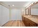 Spacious bathroom with a double vanity, granite countertops, and ample storage space at 4509 Grainary Ave, Tampa, FL 33624