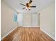 Comfortable bedroom with hardwood floors, a ceiling fan, and a closet at 4509 Grainary Ave, Tampa, FL 33624