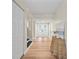 Bright entryway features wood floors, white trim, and a view to a bright living space at 4509 Grainary Ave, Tampa, FL 33624