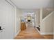 Entryway features wood floors, white trim, and a view into the living room at 4509 Grainary Ave, Tampa, FL 33624