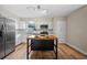 Modern kitchen featuring stainless steel appliances, white cabinets, stone countertops, and a butcher block island at 4509 Grainary Ave, Tampa, FL 33624