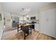 Renovated kitchen boasting stainless steel appliances, white cabinetry, an island, and modern fixtures at 4509 Grainary Ave, Tampa, FL 33624