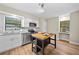 Modern kitchen featuring white cabinetry, granite countertops, stainless steel appliances and a wood topped island at 4509 Grainary Ave, Tampa, FL 33624