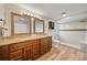 Elegant main bathroom with a dual-sink vanity, granite countertops, and a walk-in shower at 4509 Grainary Ave, Tampa, FL 33624