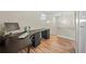 Well-lit office space featuring an expansive desk, perfect for a productive work-from-home setup at 4509 Grainary Ave, Tampa, FL 33624