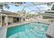 Backyard pool with screened enclosure and ample patio space at 4509 Grainary Ave, Tampa, FL 33624