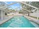Inviting pool with screened enclosure offers a refreshing escape at 4509 Grainary Ave, Tampa, FL 33624