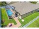 Aerial view of backyard pool, screened-in patio, and brick pavers at 4531 River Overlook Dr, Valrico, FL 33596
