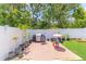 Backyard featuring a white privacy fence and brick pavers at 4531 River Overlook Dr, Valrico, FL 33596