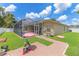 View of backyard with screened-in patio and brick pavers at 4531 River Overlook Dr, Valrico, FL 33596