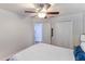 Bedroom featuring ceiling fan, hardwood floors, and a spacious closet for maximum storage at 4531 River Overlook Dr, Valrico, FL 33596