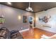 Bonus room with theater seating, movie projector and screen, with hardwood flooring at 4531 River Overlook Dr, Valrico, FL 33596