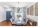 Bright dining room with modern chandelier, stylish table, and elegant decor elements at 4531 River Overlook Dr, Valrico, FL 33596