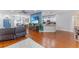 Open-concept living area featuring a dining area, kitchen bar and a TV set on the wall at 4531 River Overlook Dr, Valrico, FL 33596
