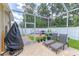 Backyard featuring a covered seating area, brick pavers and privacy fence at 4531 River Overlook Dr, Valrico, FL 33596