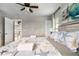 Cozy bedroom with a starfish theme, neutral tones, and access to the outdoor deck, creating a relaxing retreat at 4916 Palmetto Point Dr, Palmetto, FL 34221