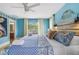 Bright bedroom features an open doorway, ceiling fan, and plenty of natural light at 4916 Palmetto Point Dr, Palmetto, FL 34221